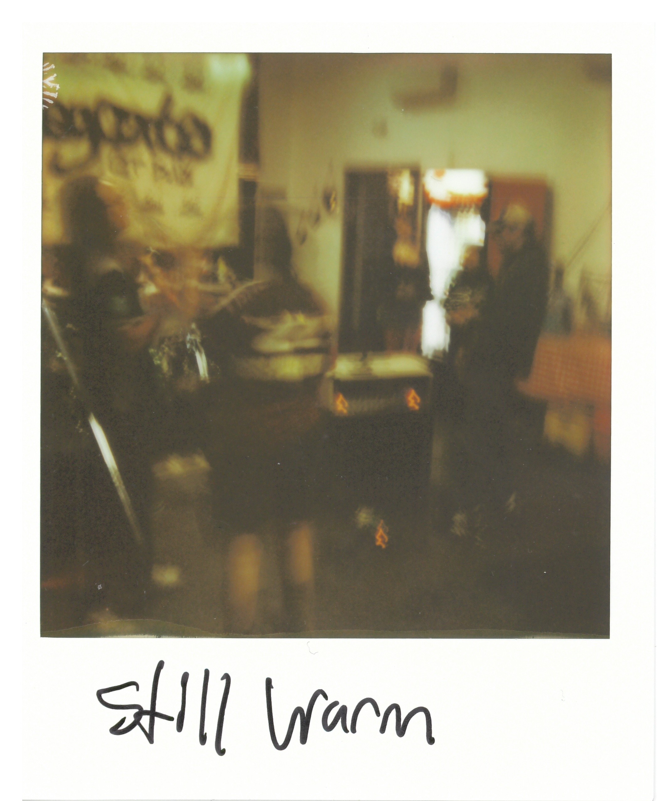 Blurry photo of the whole band, playing their set